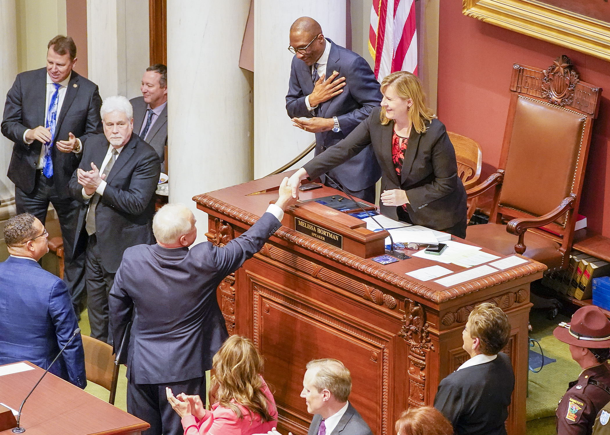 Gov. Tim Walz and House Speaker Melissa Hortman greet one another during the April 19 State of the State address. (Photo by Andrew VonBank)